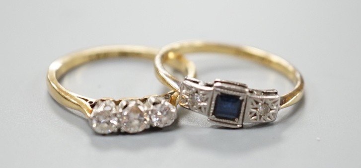 An 18ct and three stone diamond ring, size L/M and an 18ct, sapphire and diamond chip set three stone ring, gross weight 4 grams.